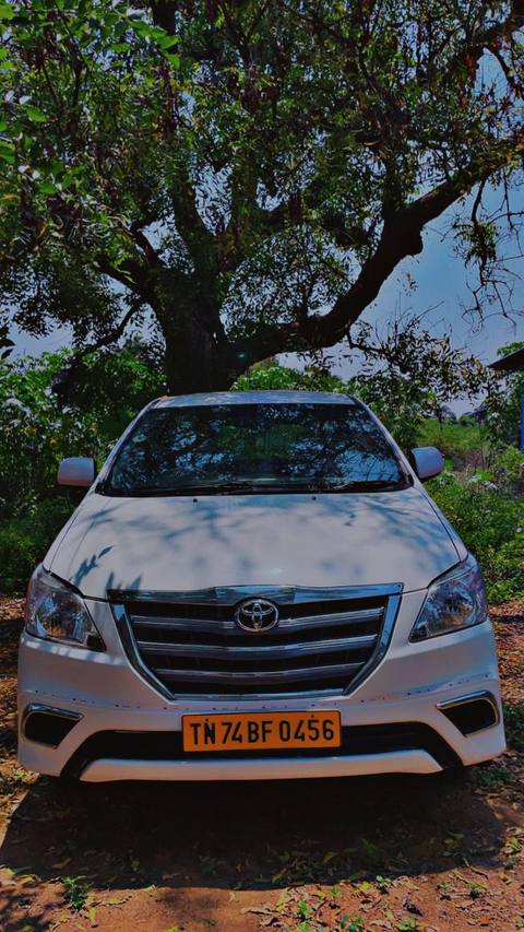 White Toyota Innova, front view